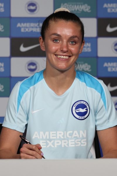 Caitlin Hayes signs for Brighton and Hove Albion at the American Express Elite Football Performance Centre during the 2024/25 season